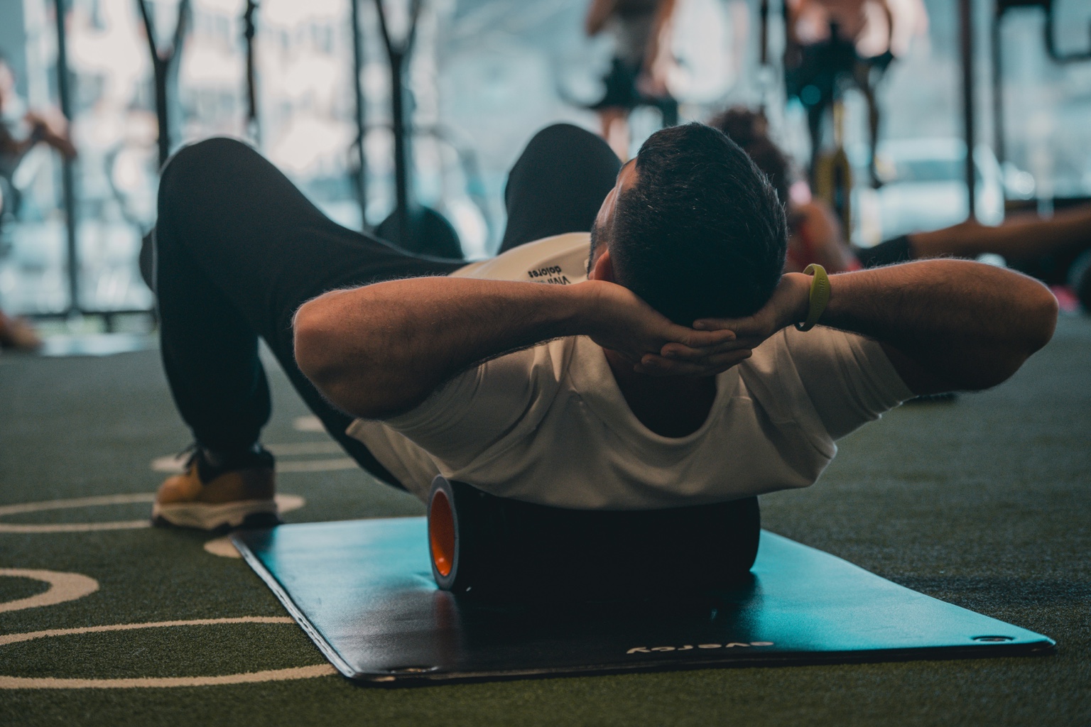 Athlete using a foam roller during a recovery session